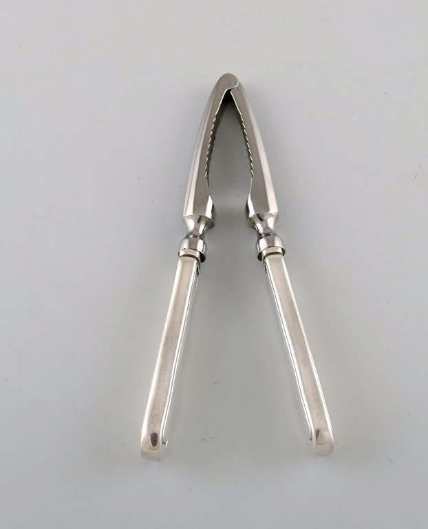 Georg Jensen Old Danish nut cracker in sterling silver and stainless steel.