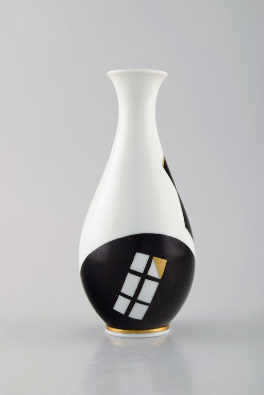 Hackefors, Sweden. Concretistic vase in hand-painted porcelain. Black and gold. 
1960