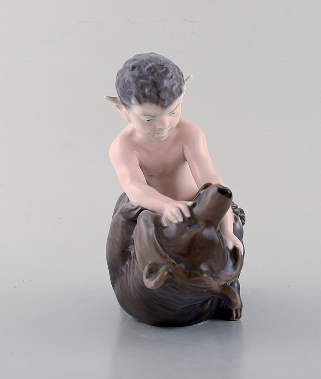 Royal Copenhagen porcelain figurine. Faun with bear.
