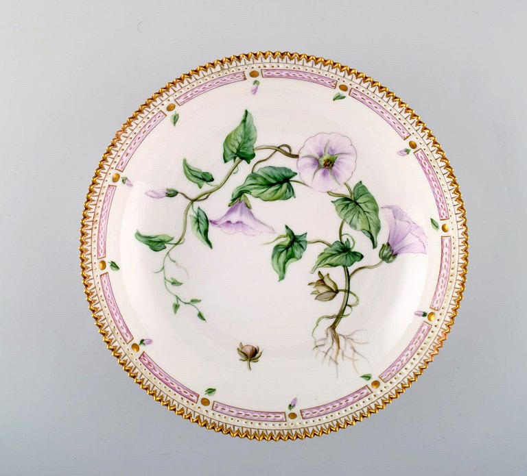 Large Royal Copenhagen flora danica porcelain bowl with hand-painted flowers and 
gold decoration.
