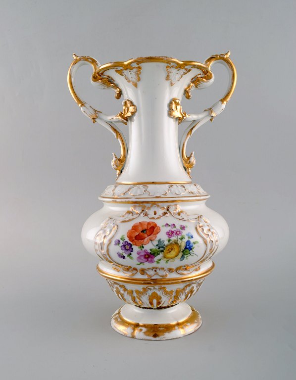 Large antique Meissen vase with handles in hand-painted porcelain with flowers 
and gold decoration. Late 19th century.
