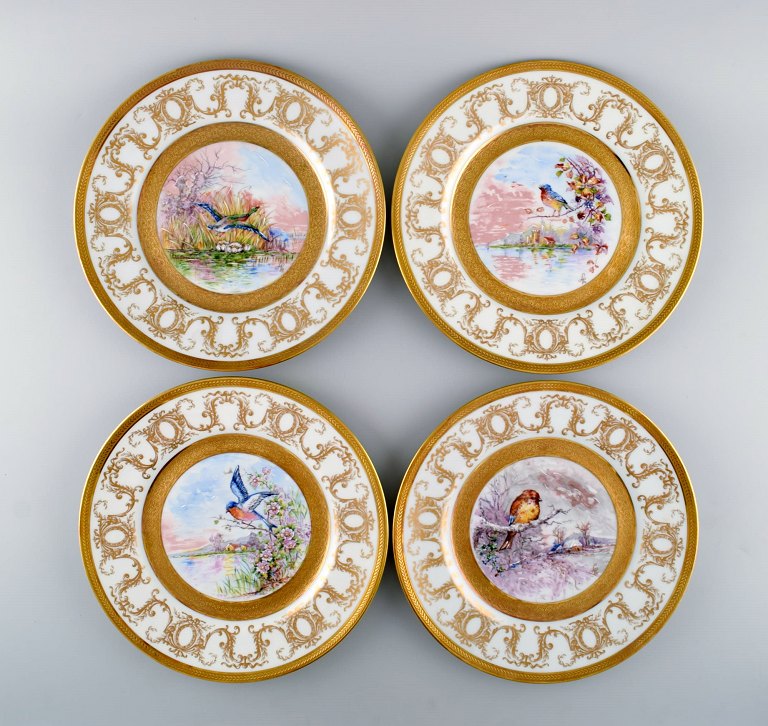 Camille Tharand for Limoges. Four decorative plates in porcelain with gold leaf 
and hand-painted birds. 1930s.
