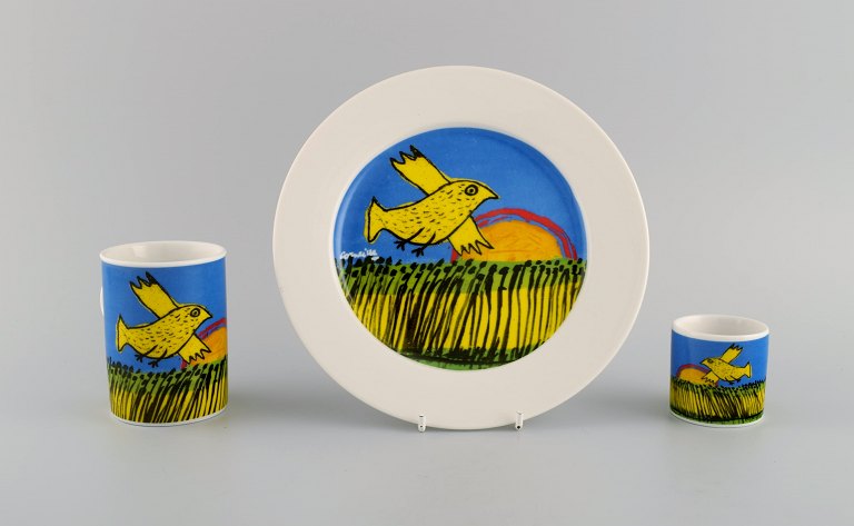 Corneille (Guillaume Cornelis van Beverloo), Dutch CoBrA artist (1922-2010). 
Coffee cup, plate and egg cup in porcelain decorated with birds over field with 
sunrise. 1980s / 90s.
