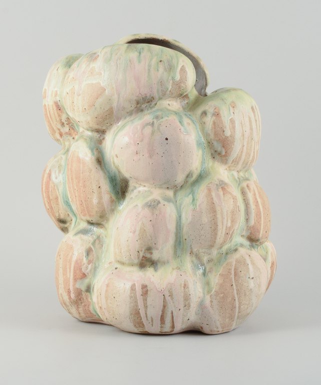 Christina Muff, Danish contemporary ceramicist (b. 1971). 
Monumental organically shaped vase. This piece is covered in multicolored 
pastel glaze, the clay showing between glaze runs.