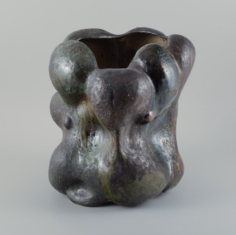 Christina Muff, Danish contemporary ceramicist (b. 1971). 
Monumental work in stoneware clay, covered in blackish green glaze with the 
occasional specks of blue on a semi-rough surface.