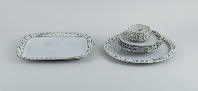 Jens H. Quistgaard (1919-2008) for Bing & Grøndahl / Nissen Kronjyden. Six parts 
gray "Cordial" consisting of
A round dish, an oval dish, a small deep plate, two side plates and a 
candlestick.