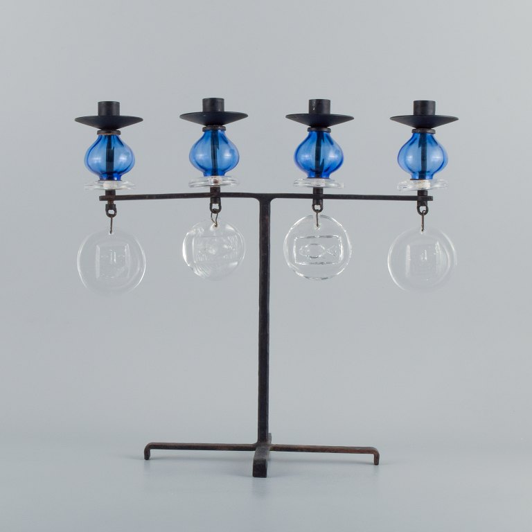 Erik Höglund for Kosta Boda, large candle holder in cast iron with mouth blown 
glass.