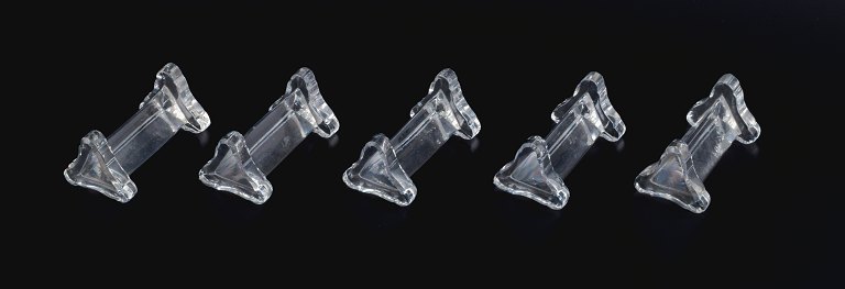 Baccaret, France, a set of five art deco knife rests in crystal glass.