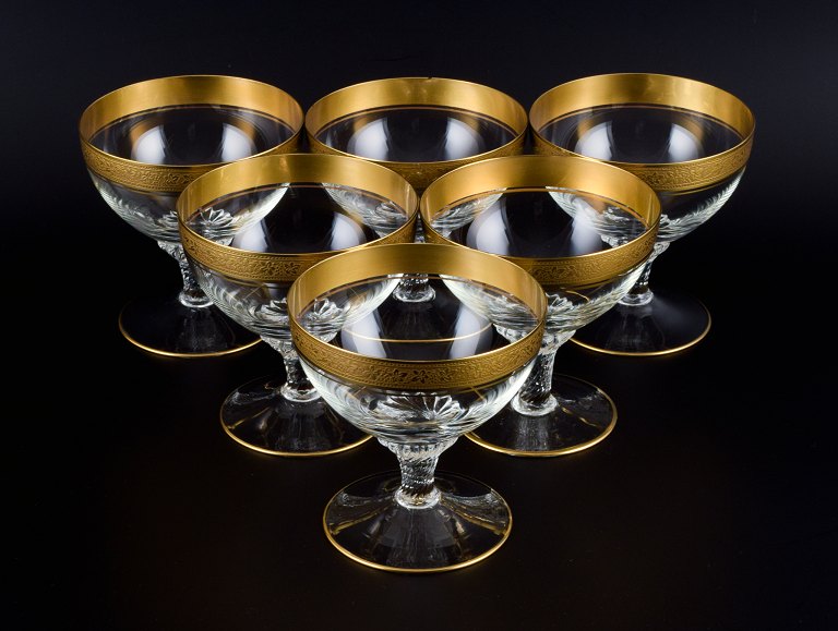 Rimpler Kristall, Zwiesel, Germany, six mouth-blown crystal champagne glasses 
with gold rim decorated with grapes and vine leaves.