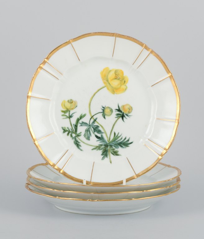Bing and Grøndahl, four porcelain plates in Flora Danica style with gold 
decoration.