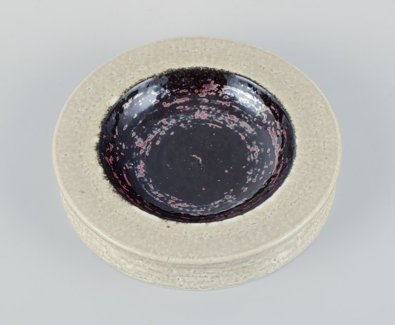 Rörstrand, Sweden, ceramic bowl in cream and black metallic glaz