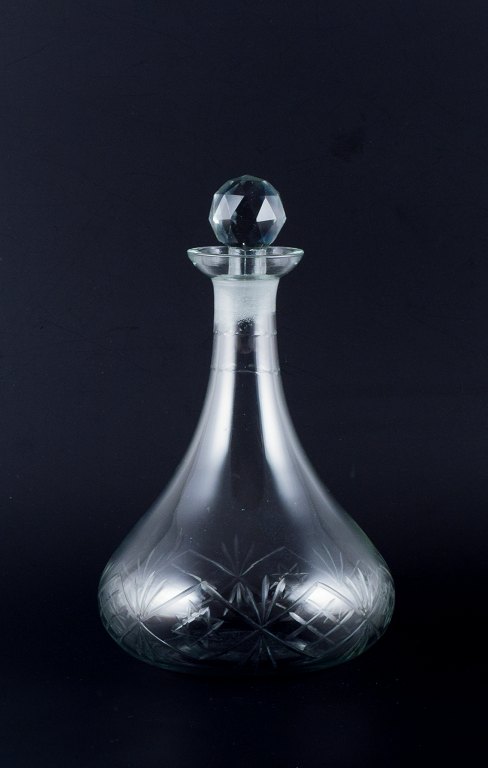 Danish glasswork, wine decanter in clear glass. Ball-shaped faceted stopper.