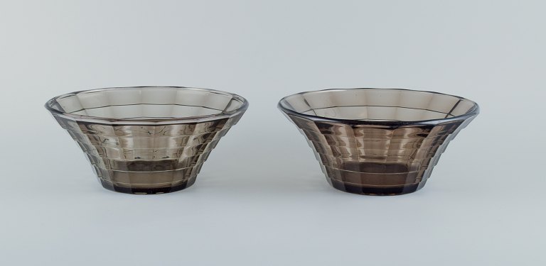 Simon Gate (1883-1945) for Orrefors/Sandvik, Sweden.
Two large Art Deco bowls in smoked coloured pressed glass.