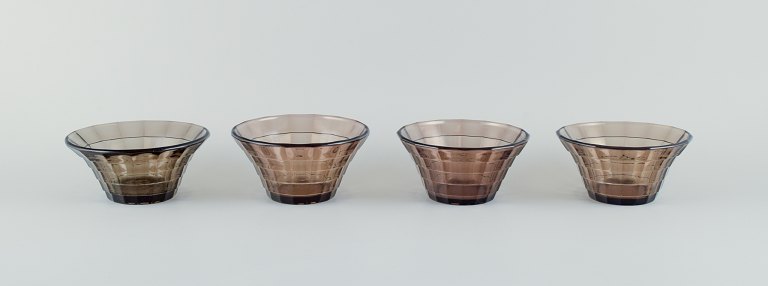 Simon Gate (1883-1945) for Orrefors/Sandvik, Sweden.
A set of four Art Deco bowls in smoked coloured pressed glass.