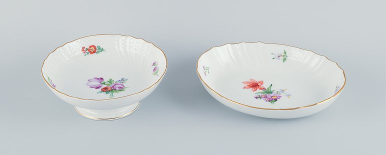 Royal Copenhagen, Saxon Flower, a centerpiece and oval bowl hand-decorated with 
polychrome flowers and a gold rim.