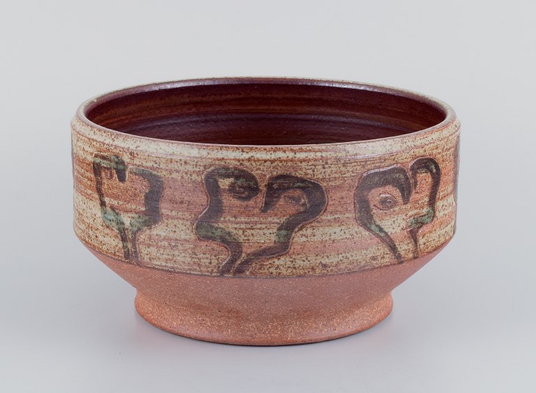 Mogens Nielsen, Nysted, Denmark, large handmade ceramic bowl decorated with 
abstract motifs. Glazed in brown tones.