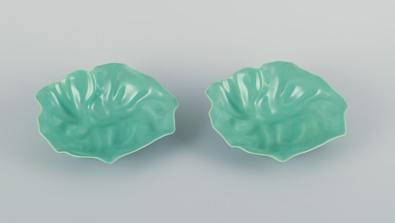 Royal Copenhagen, "4 All Seasons". Two organic-shaped bowls in faience with 
green glaze.