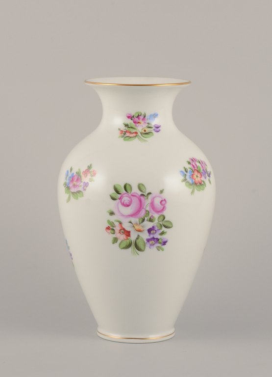 Herend, Hungary. Large porcelain vase hand-painted with polychrome flower motifs 
and gold edge.
