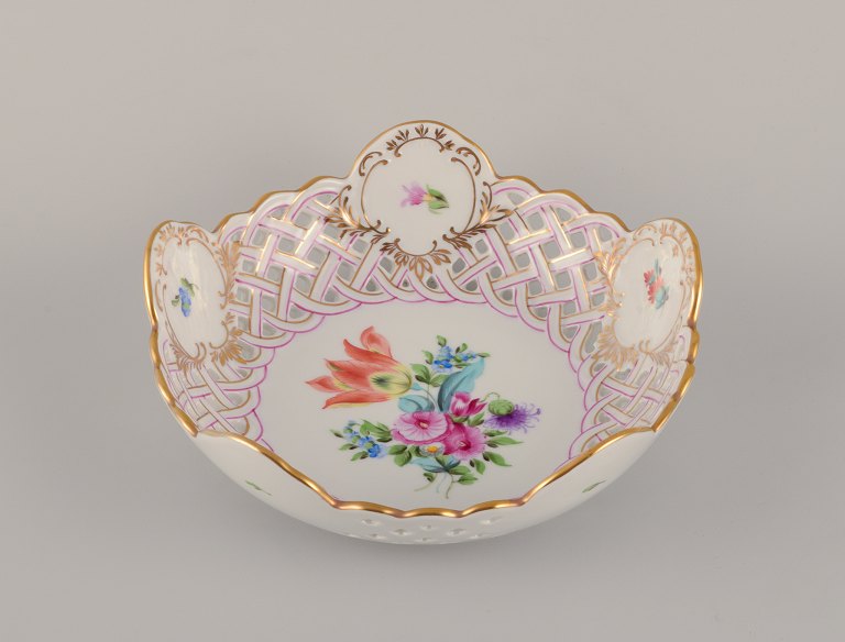 Herend, Hungary. Open lace porcelain bowl with hand-painted polychrome flower 
motifs and gold decoration.