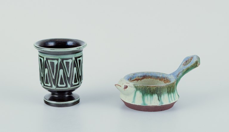 Kähler, Denmark. Small vase and small bowl with a handle shaped like a bird. 
Handmade ceramic. Vase with a geometric pattern.
Glaze in blue and green tones.