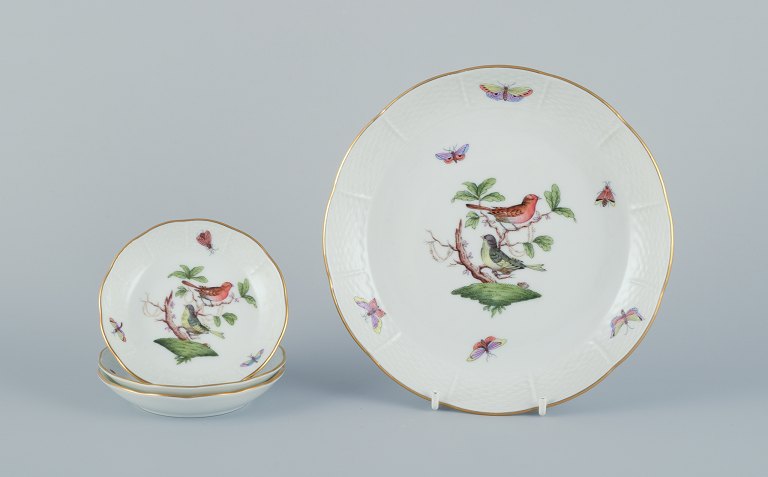 Herend, Hungary. Set of four porcelain bowls hand-painted with butterflies and 
birds on branches. Gold rim.
