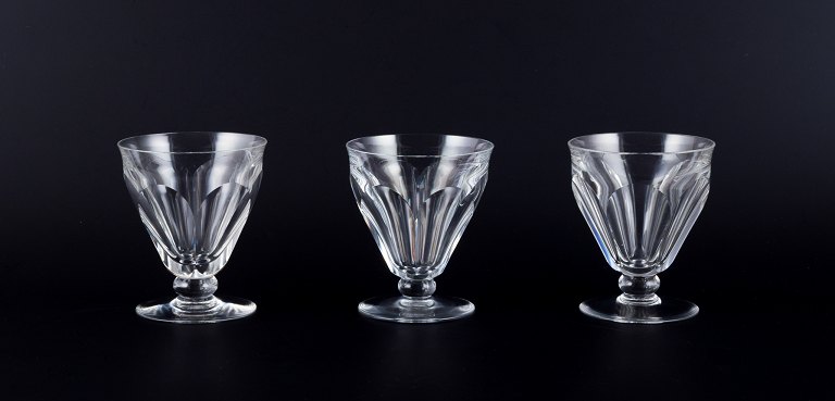 Baccarat, France. A set of three Art Deco red wine glasses in faceted crystal 
glass.