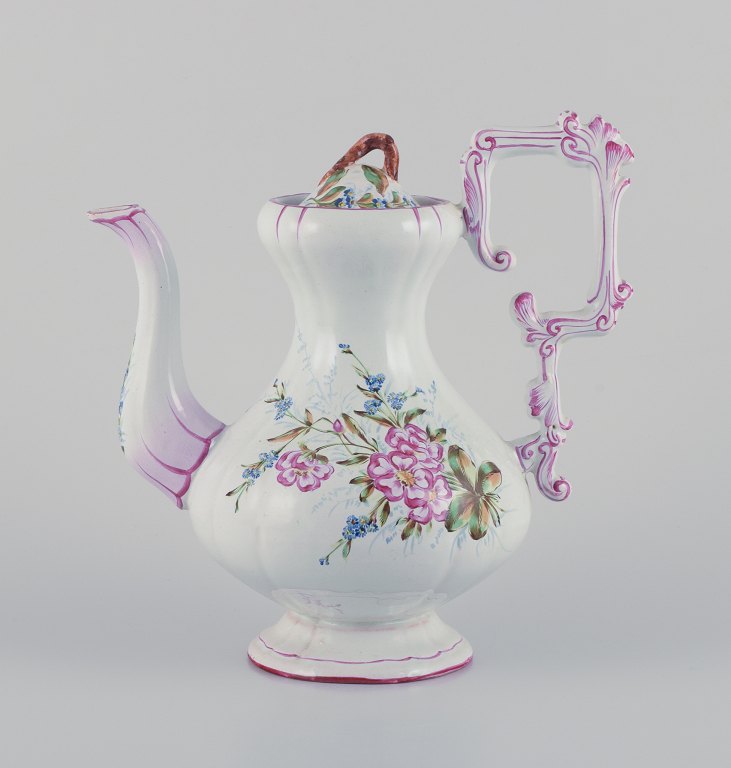 Emile Gallé (style of). Large coffee pot in faience with motifs of flowers and 
insects.