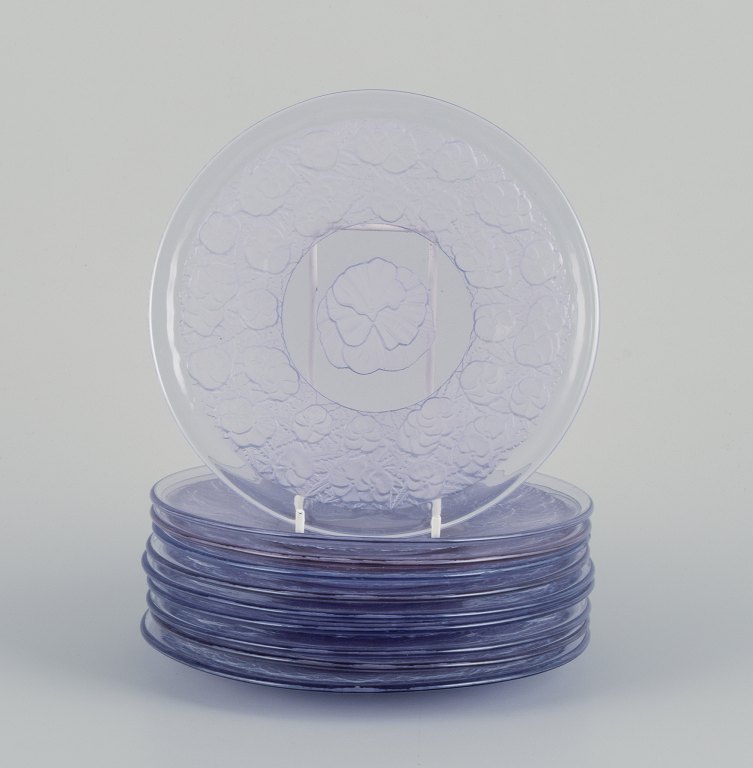 Lalique-style. A set of ten glass plates designed with flower motifs in purple 
glass.