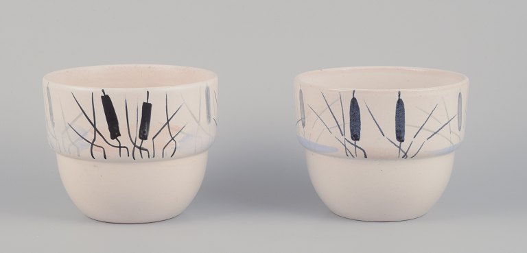 Paul Milet for Sevres, France. A pair of unique ceramic plant pot holders. 
Hand-decorated with cattails.