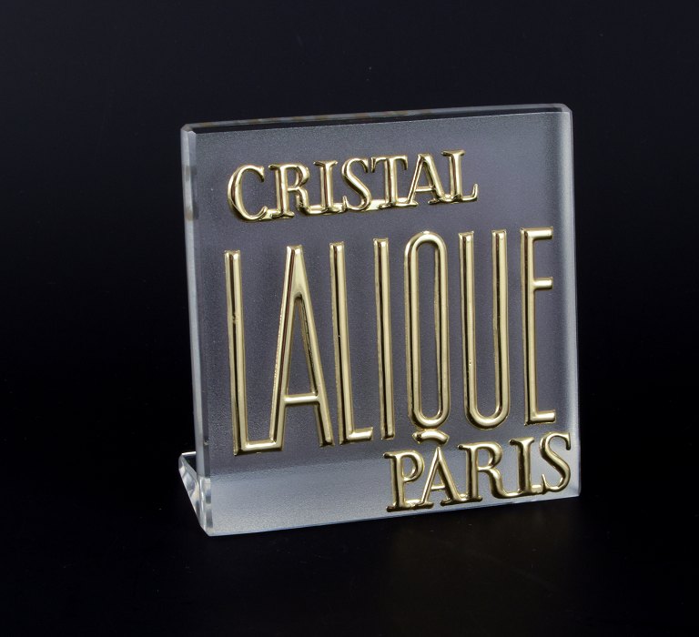 René Lalique, France. Exhibition sign/store sign in partially frosted glass. 
Gold lettering.