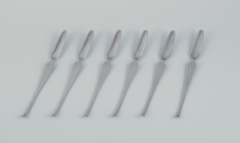 Kaj Franck for Hackman, Finland. A set of six "Scandia" lobster forks in 
stainless steel.