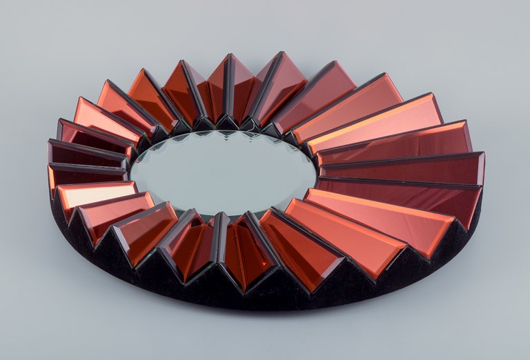 Olivier de Schrijver (1958), French designer. Futuristic "Simba Rouge" unique 
wall mirror made of copper-colored metallic acrylic glass. Faceted mirror.