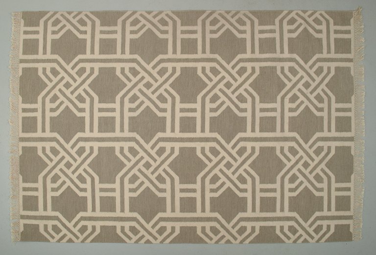 Swedish textile designer. Large handwoven carpet in pure wool. Gray base with 
white lines.