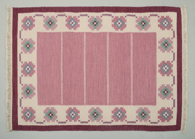 Swedish handwoven carpet in pure wool. Rölakan technique. Geometric pattern in 
blue, green, white, violet, and pink colors.