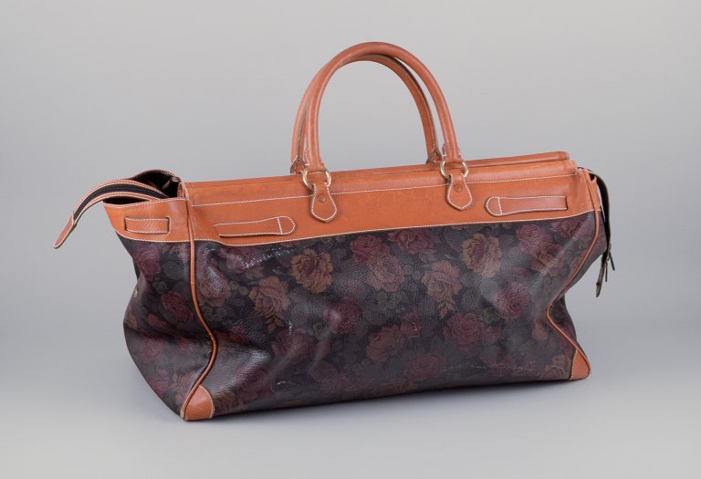 Longchamp, France. Travel bag in full-grain leather with a rose motif.