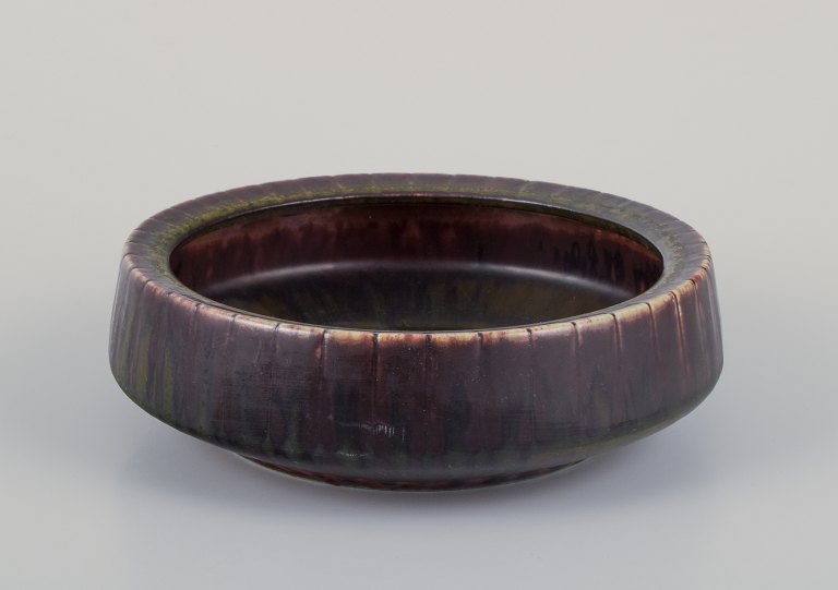 Gunnar Nylund for Rörstrand, Sweden. Ceramic bowl with glaze in brown and green 
tones.