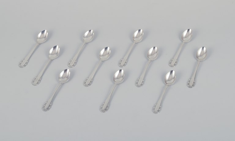 Georg Jensen Lily of the Valley. A set of eleven coffee spoons in sterling 
silver.