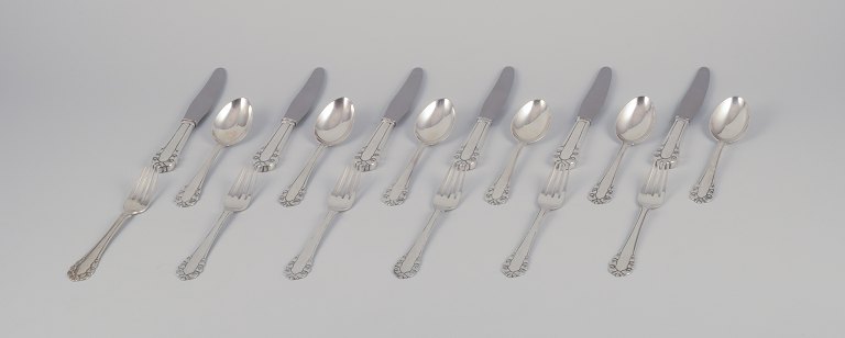 Georg Jensen Lily of the Valley. Complete lunch service consisting of six lunch 
knives, six lunch forks, and six dessert spoons.