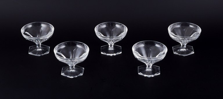 Baccarat, France, a set of five Art Deco champagne bowls in clear crystal glass. 
Faceted design.