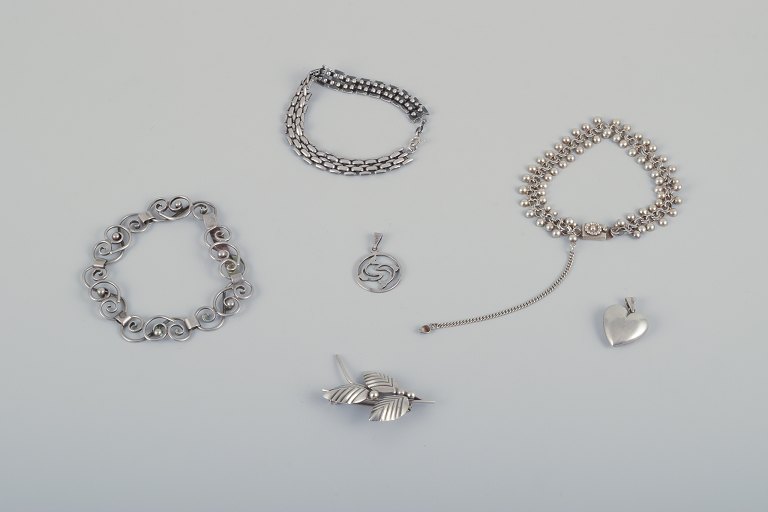 N. E. From and other Danish silversmiths. Three bracelets, one brooch, and two 
pendants in sterling silver and 830 silver.