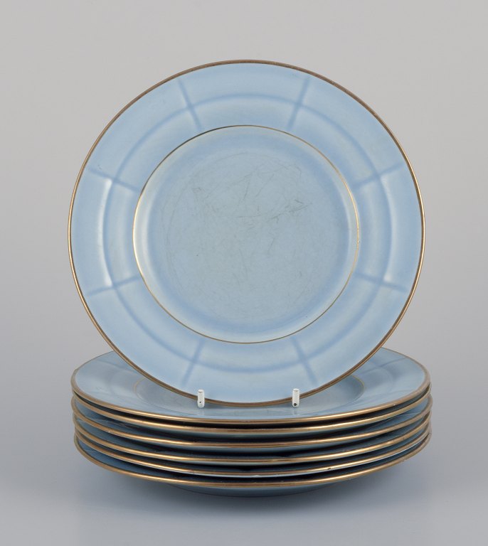 Arthur Percy for Gefle, Sweden. Seven Art Deco "Grand" plates in pastel blue 
porcelain with hand-painted gold trim.