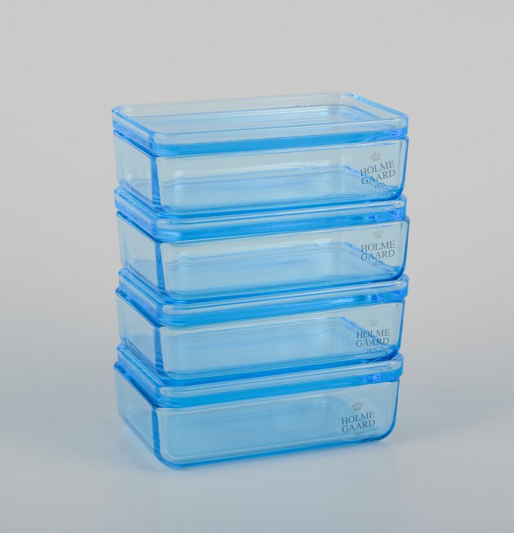 Rauff & Møldrup for Holmegaard. Set of four small Thurø storage boxes in 
turquoise-blue art glass.