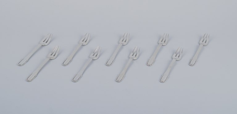 Georg Jensen Beaded, nine cake forks in sterling silver.