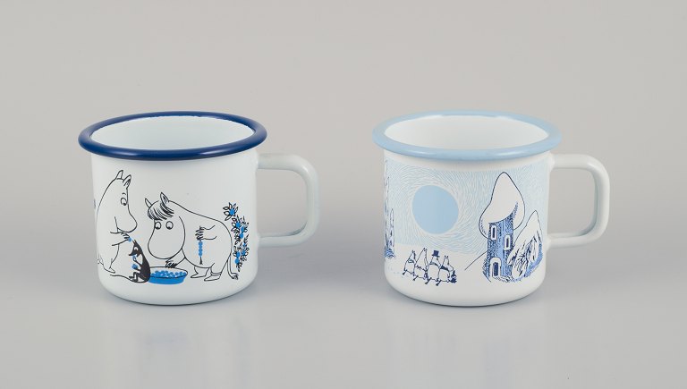 Muurla, Finland. Two enamel mugs with handles. Featuring illustrations of 
Moomins.