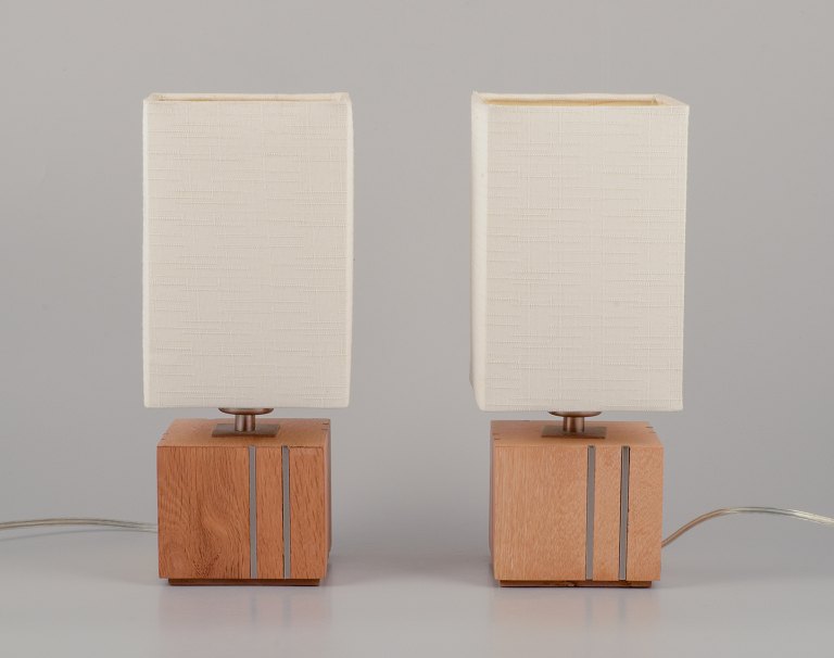 Markslöjd, Sweden.
A pair of table lamps in light wood inlaid with steel, textile shade.