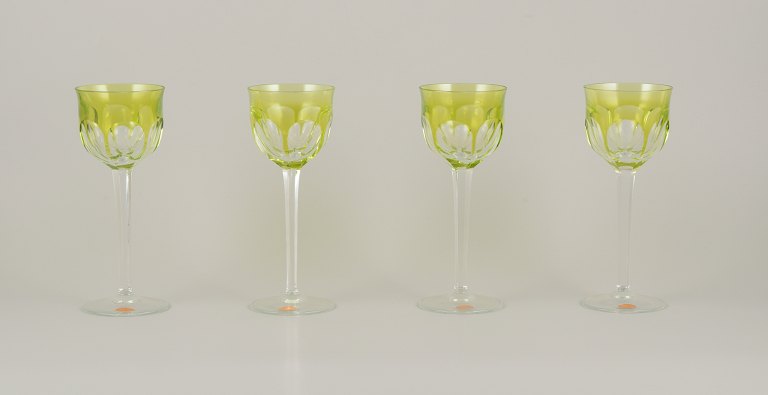 Moser, Czech Republic.
A set of four tall white wine glasses in clear and green glass.