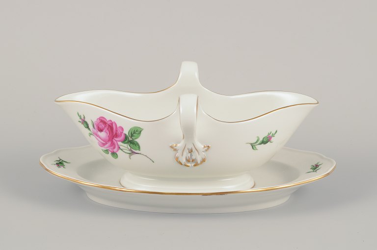 Meissen, Germany. Sauce boat on a stand with a motif of a pink rose.