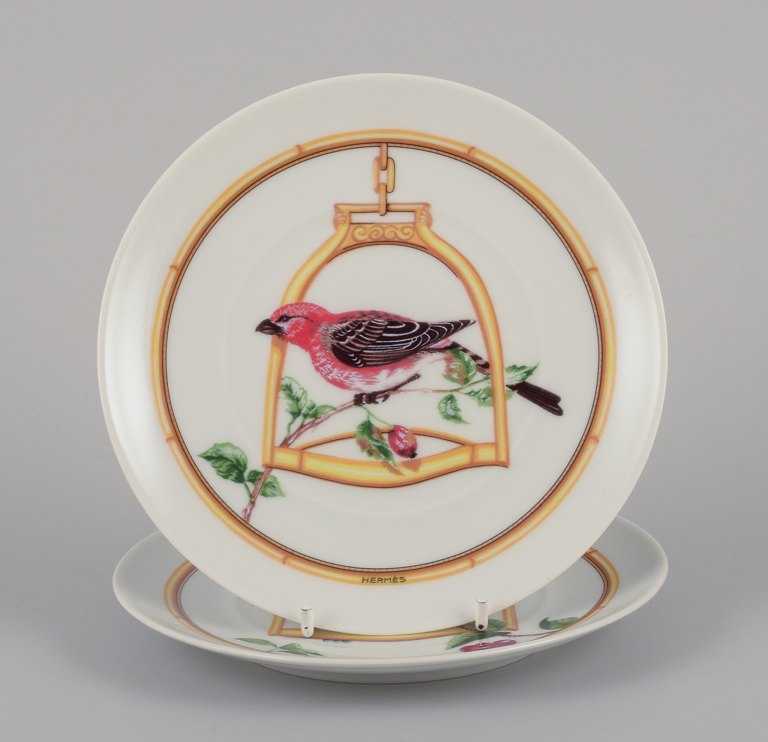 Hermès, France. Two porcelain plates with bird motifs.