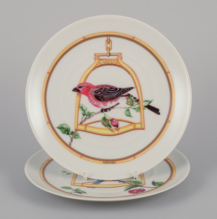 Hermès, France. Two porcelain plates with bird motifs.