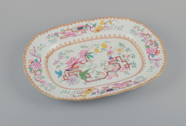 Mintons, England.
Large antique serving platter in faience.